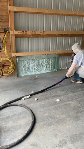 Technician applying spray foam