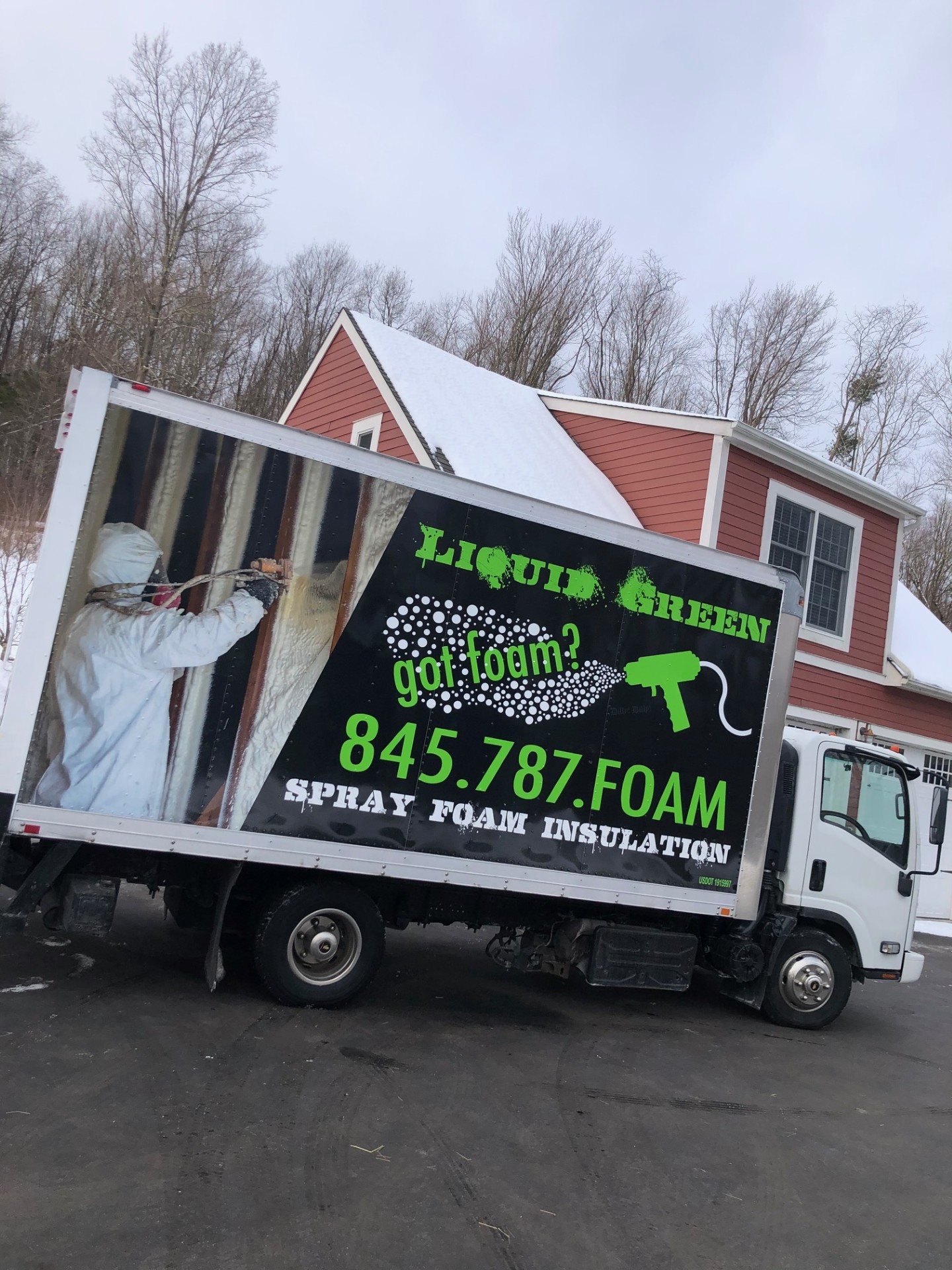 Liquid Green truck at a townhouse job site