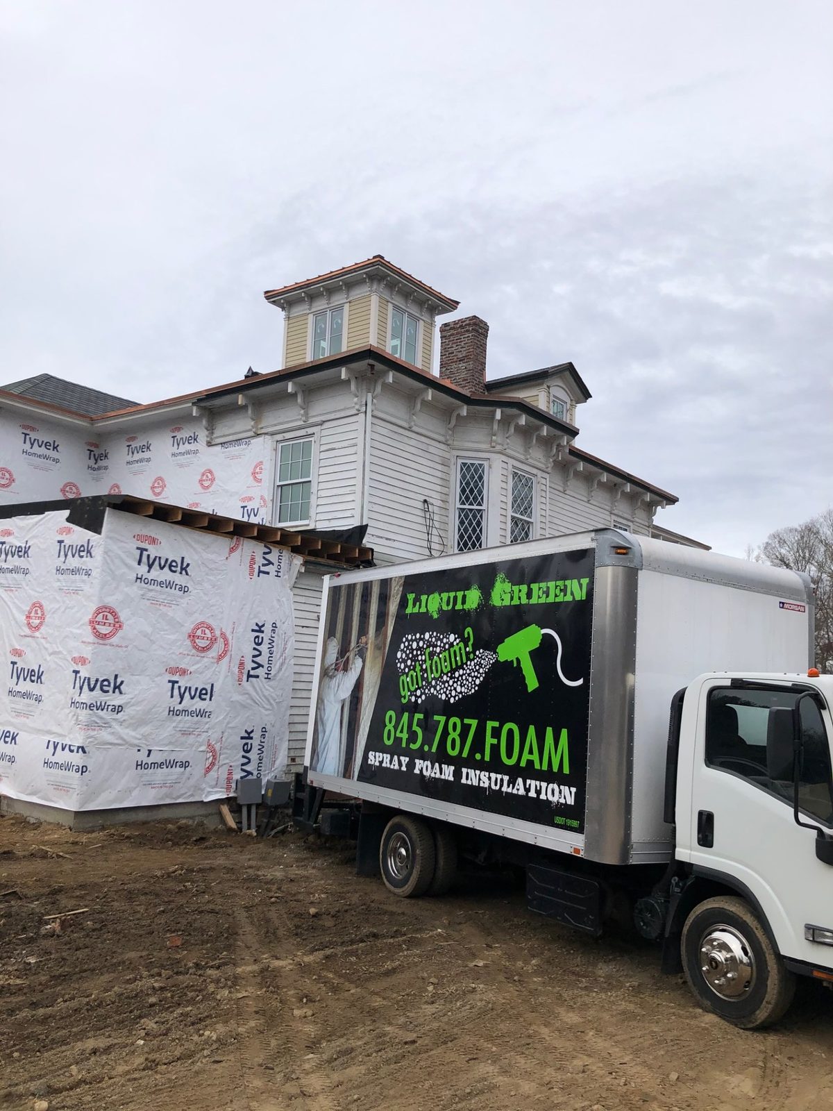 Liquid Green truck at a townhouse